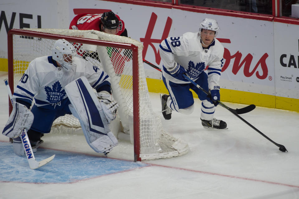 Sandin, right, looks to make a play in his own zone. (Marc DesRosiers-USA TODAY Sports)