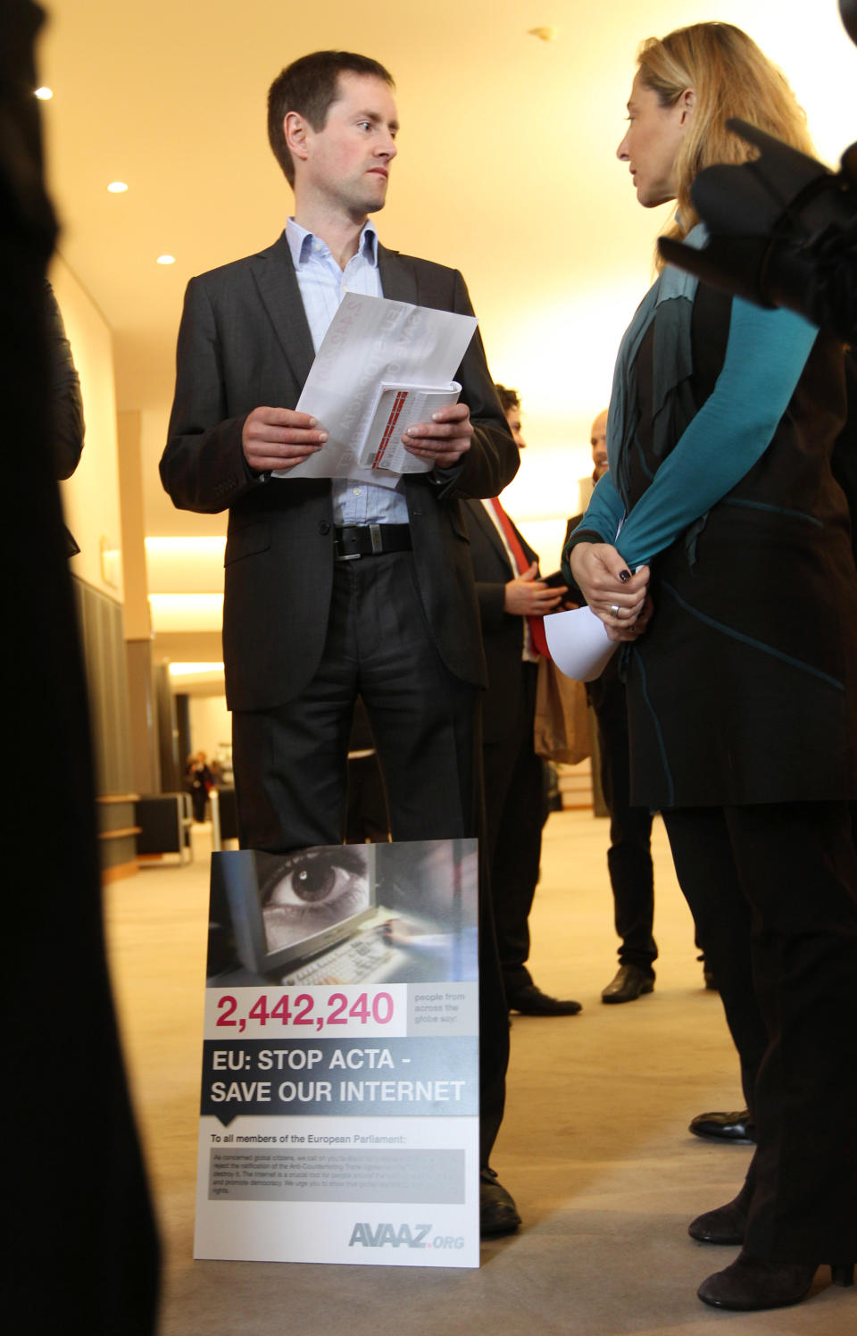 Avaaz's campaign director Alex Wilks talks to the media, prior to hand over a petition against the Anti-Counterfeiting Trade Agreement (ACTA), to members of the European Parliament, at the European Parliament in Brussels, Tuesday, Feb. 28, 2012. Avaaz is an organization that uses the Internet to mobilize support for various political issues. (AP Photo/Yves Logghe)