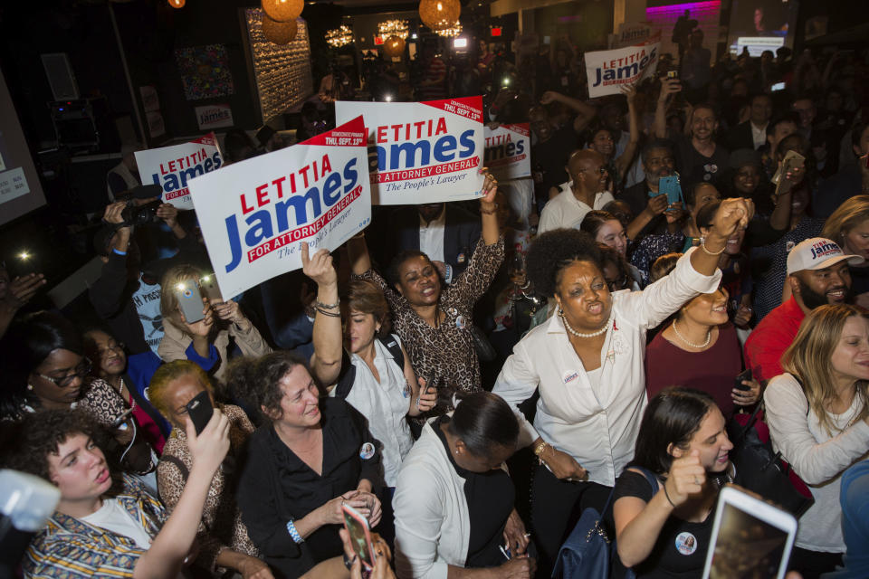 Supporters celebrate after the Democratic primary for attorney general was called in favor of Letitia James Thursday, Sept. 13, 2018, in New York. The 59-year-old was an early favorite in the race after getting endorsements from Gov. Andrew Cuomo and other top Democrats. (AP Photo/Kevin Hagen)