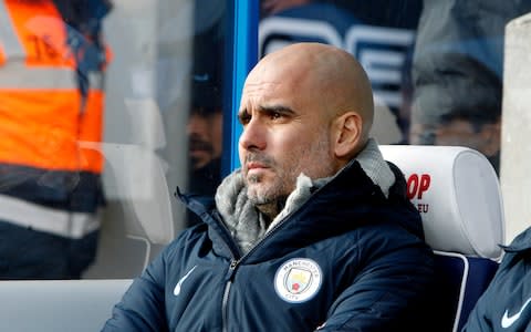 Pep Guaridola looks on  - Credit: Getty images