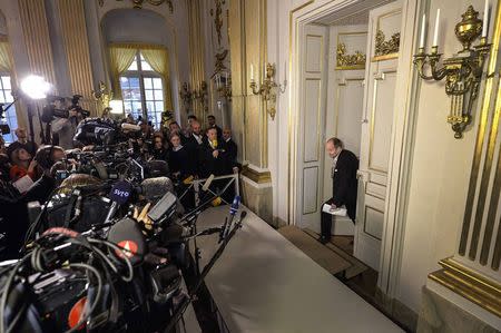 Peter Englund, permanent secretary of the Swedish Academy, steps out of his office to announce French writer Patrick Modiano as the winner of the 2014 Nobel Prize for Literature in Stockholm October 9, 2014. REUTERS/Anders Wiklund/TT News Agency