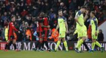 Britain Football Soccer - AFC Bournemouth v Liverpool - Premier League - Vitality Stadium - 4/12/16 Bournemouth's Benik Afobe celebrates with Callum Wilson and Ryan Fraser after the game as Liverpool's Jordan Henderson and Lucas Leiva look dejected Action Images via Reuters / Paul Childs Livepic