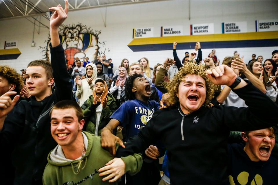 Fairdale students erupt in cheers as the Bulldogs take a late lead over Spencer County. Fairdale won, 69-67, on Thursday at the King of the Bluegrass tournament.