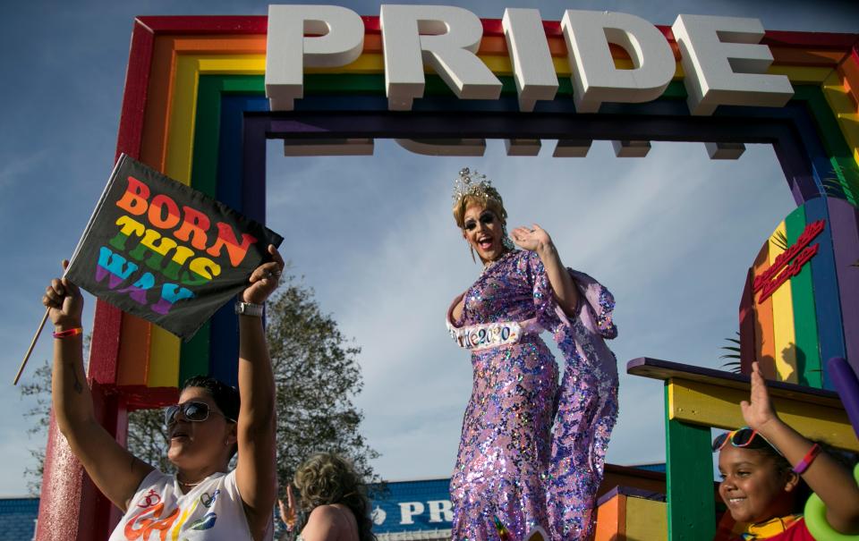 Alyssa Lemay, center, waves to the crowd during the PRIDE parade in Cape Coral on Saturday, March 7, 2020.