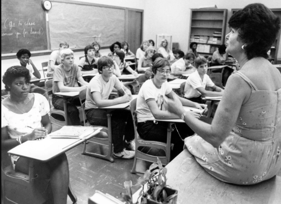 Fran Scheidt teaches ninth-grade English at West High School in 1983. The retired educator, master of gardens and flowers, and supporter of progressive politicians died April 13 at the age of 96.