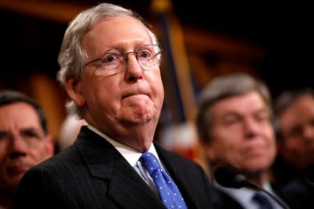 Senate Majority Leader Mitch McConnell, accompanied by members of the Republican Conference, speaks at a news conference about the passage of the Tax Cuts and Jobs Acts at the U.S. Capitol in Washington, U.S., December 20, 2017. REUTERS/Aaron P. Bernstein