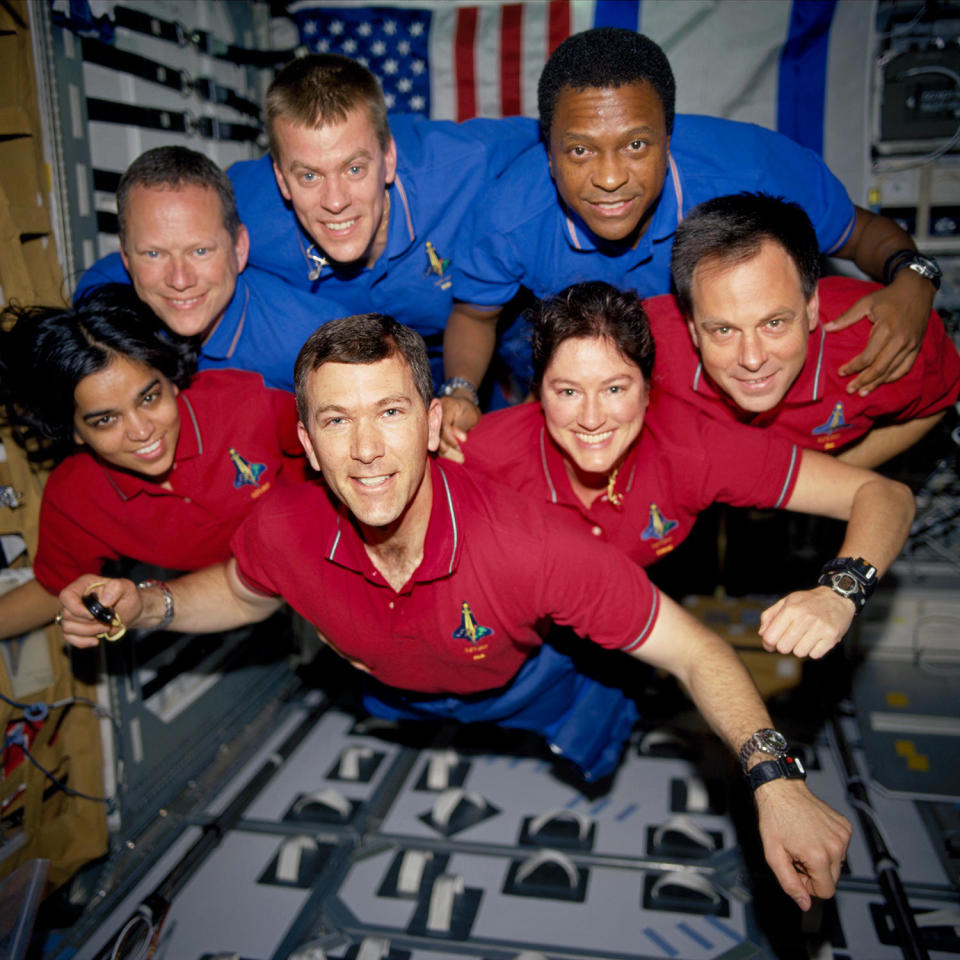 The shuttle Columbia's crew, enjoying the weightless environment of space to capture a unique portrait. Wearing blue shirts, left to right: David Brown, pilot Willie McCool and Michael Anderson. Wearing red shirts, left to right: Kalpana Chawla, commander Rick Husband, Laurel Clark and Israeli guest astronaut Illan Ramon. / Credit: NASA