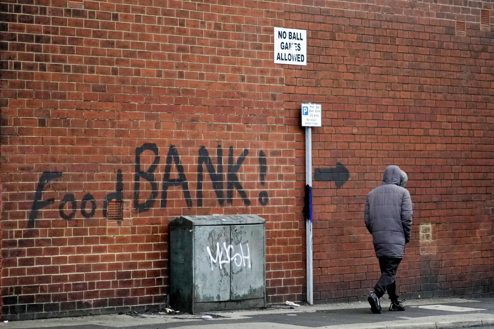 Cost of living LEEDS, ENGLAND - OCTOBER 21: A sign painted on the side of a house directs people to a local food bank on October 21, 2022 in Leeds, England. A report from the Office for National Statistics (ONS) published earlier this week showed consumer prices index rising to 10.1% in September, with food and drink rising at a rate of 15%, the largest jump in decades and forcing many people to use charity food banks. (Photo by Christopher Furlong/Getty Images)