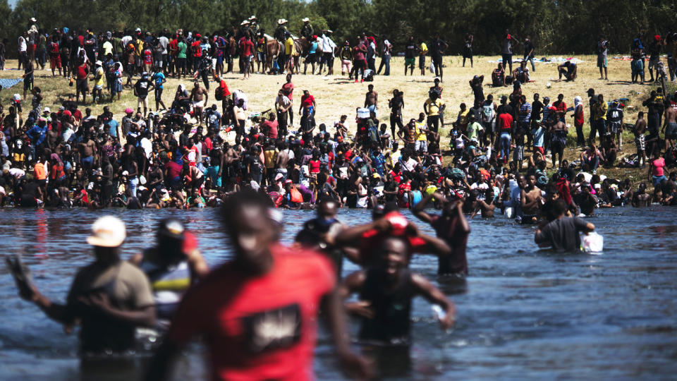 Migrants cross the Rio Grande River 