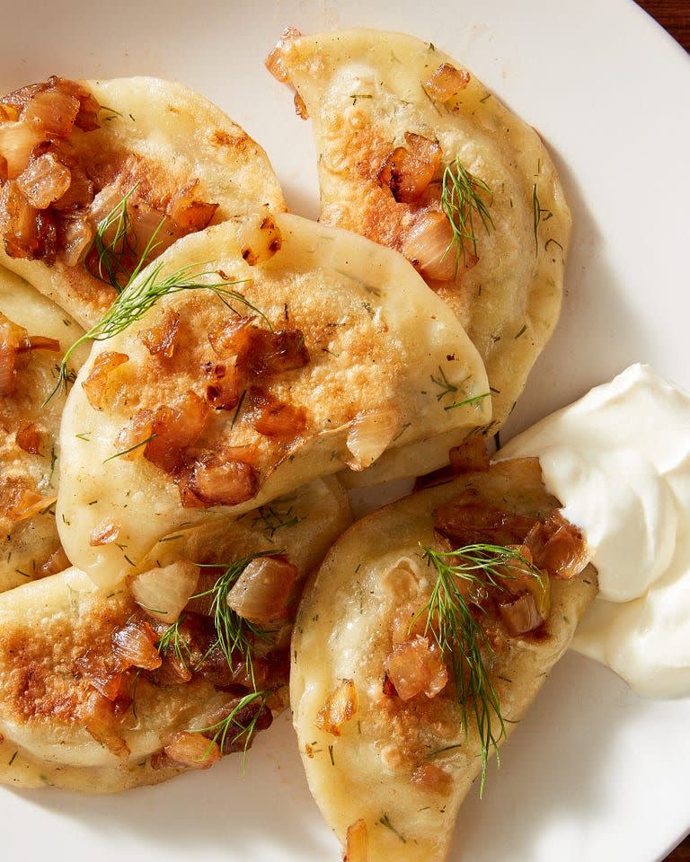 <p>When you're looking for something warm, comforting, and carb-y, do Polish pierogi come to mind? We think they should, and this cheesy dill version certainly satisfies on all fronts. Loaded with sharp white cheddar, sweet caramelized onions, and creamy <a href="https://www.delish.com/cooking/recipe-ideas/recipes/a50630/perfect-mashed-potatoes-recipe/" rel="nofollow noopener" target="_blank" data-ylk="slk:mashed potatoes" class="link ">mashed potatoes</a>, the only thing more gratifying than making them from scratch is stuffing them in your mouth. 😋<br><br>Get the <strong><a href="https://www.delish.com/cooking/recipe-ideas/a37941002/pierogi-recipe/" rel="nofollow noopener" target="_blank" data-ylk="slk:Dill & Cheddar Pierogis recipe" class="link ">Dill & Cheddar Pierogis recipe</a></strong>. </p>