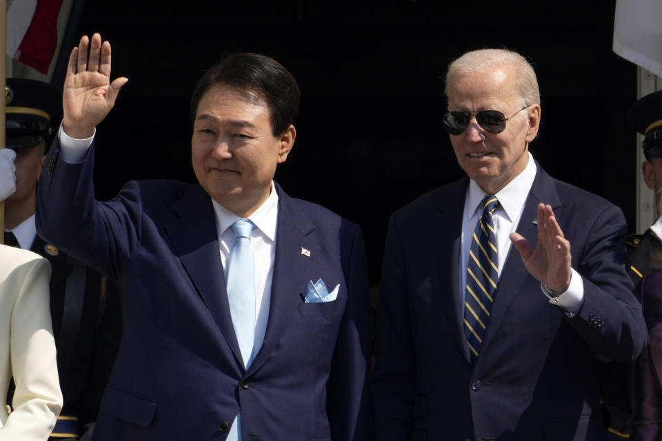 President Joe Biden and South Korea's President Yoon Suk Yeol wave from the Blue Room Balcony during a State Arrival Ceremony on the South Lawn of the White House Wednesday, April 26, 2023, in Washington. (AP Photo/Andrew Harnik)