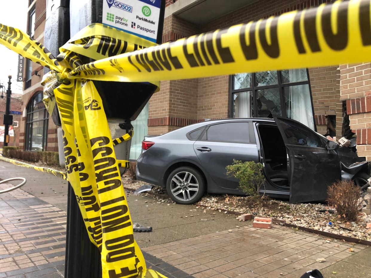 A car LMPD said was stolen crashed Thursday morning into a downtown Louisville building after a chase. March 23, 2023