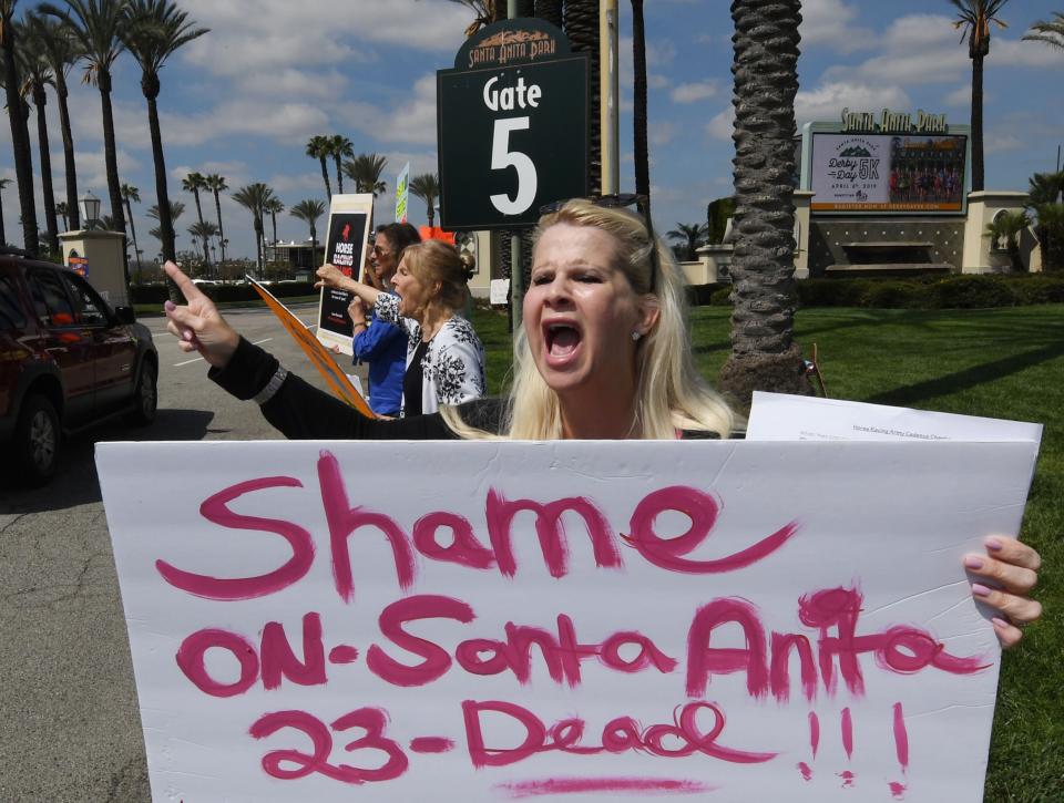 Animal-rights advocates protest the deaths of 23 racehorses in the first three months of this year beside the entrance gate of the Santa Anita Racetrack in Arcadia, California. Santa Anita Park averaged more than 55 horse deaths per year from 2008-18, according to data from the California Horse Racing Board, a total of 553 deaths in all, but this year's major rise in deaths is under investigation. (Getty Images)