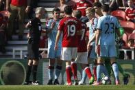 Britain Football Soccer - Middlesbrough v Burnley - Premier League - The Riverside Stadium - 8/4/17 Referee Martin Atkinson with Burnley's Joey Barton Action Images via Reuters / Craig Brough Livepic