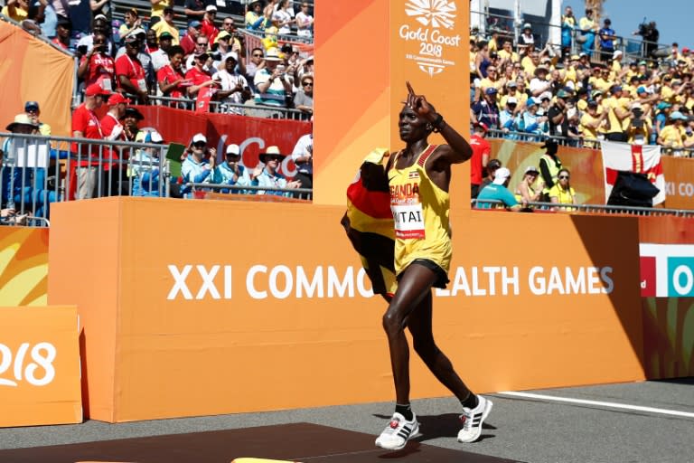 Uganda's Munyo Solomon Mutai reacts as he crosses the finish line in second place in the men's marathon during the 2018 Gold Coast Commonwealth Games