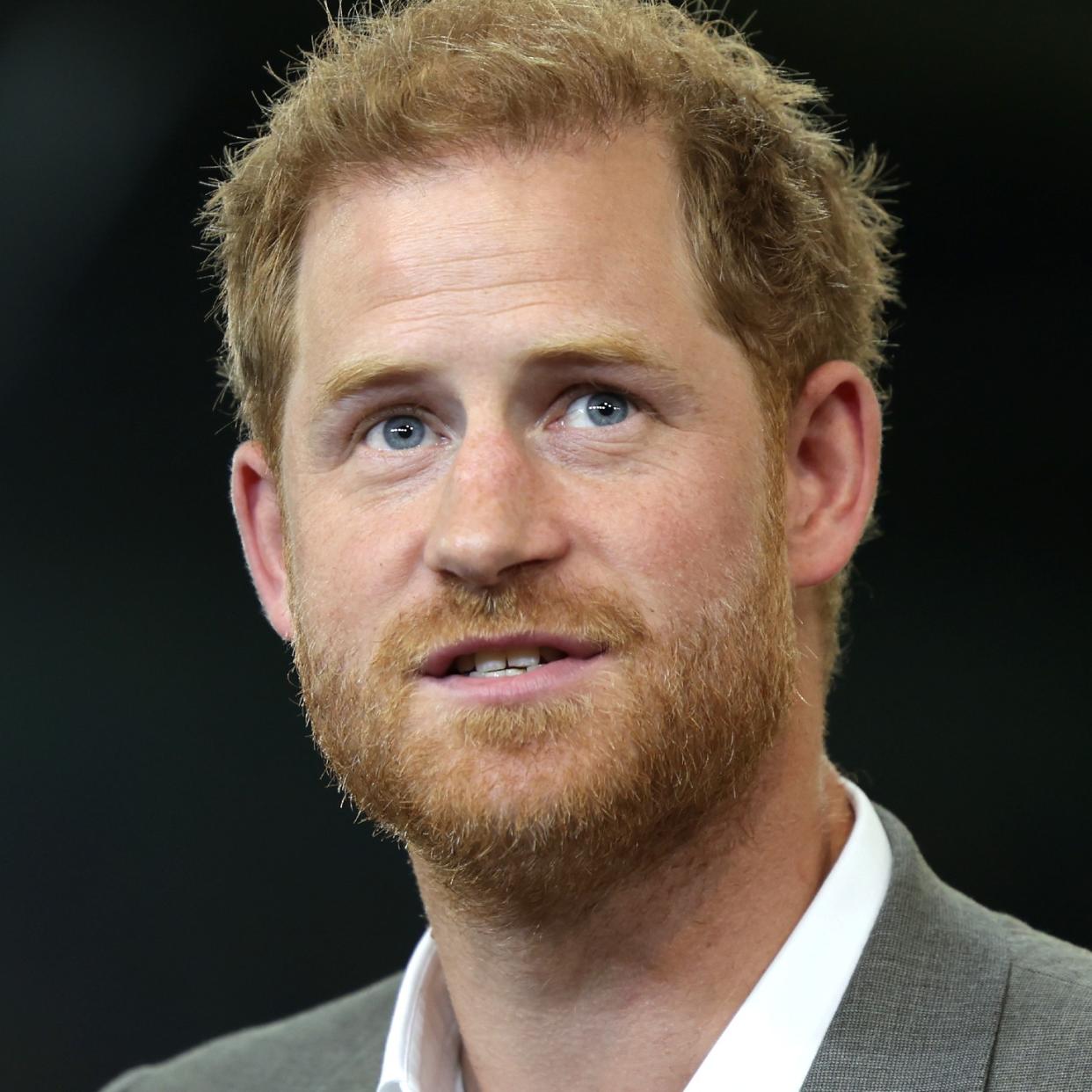  A member of the public poses in his front room in Manchester, north-west England, watching a television interview broadcast on ITV, being given by Britain's Prince Harry, Duke of Sussex on January 8, 2023, ahead of the publication of his book, 'Spare'. - Prince Harry discusses his memoirs in a television interview Sunday after the book's explosive revelations about royal rifts, sex and drugs cast doubt on his future in the British royal family. The 38-year-old prince's ghost-written book "Spare" was widely leaked after it mistakenly went on sale in Spain ahead of the official publication date Tuesday. 