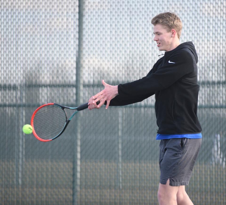 Sartell junior Grant Clark makes contact with the ball Tuesday, April 26, 2022, at Tech High School.