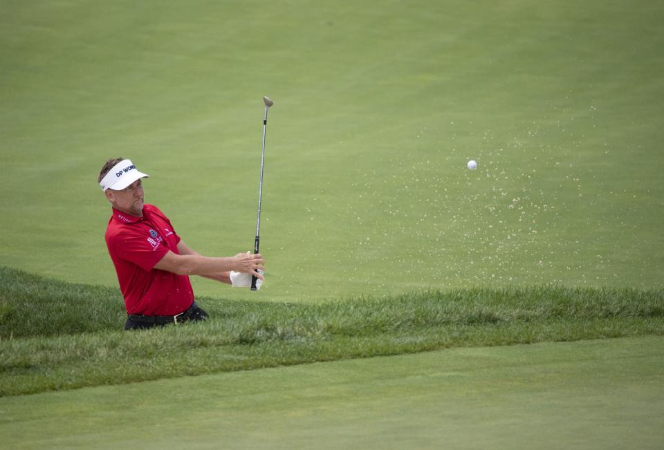 Ian Poulter hits out of a bunker onto the 16th green at the 2020 Memorial.