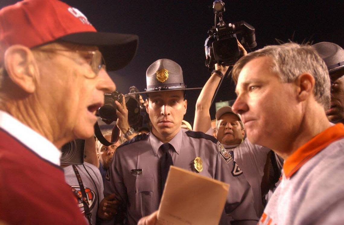 University of South Carolina Lou Holtz, left talks to Clemson coach Tommy Bowden after losing 63-14 to Clemson at Williams Brice Stadium on Saturday 11/22/2003. Erik Campos/The State