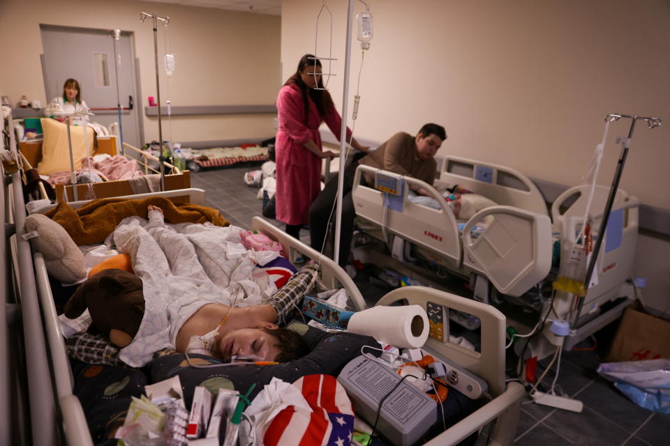 Children patients whose treatments are underway stay in their beds moved to the hallways of the basement floor of Okhmadet Children's Hospital, as Russia's invasion of Ukraine continues, in Kyiv, Ukraine February 28, 2022. (Umit Bektas/Reuters)