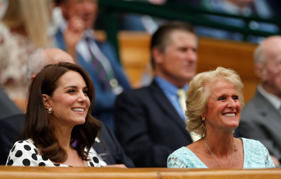 The Duchess of Cambridge looks on