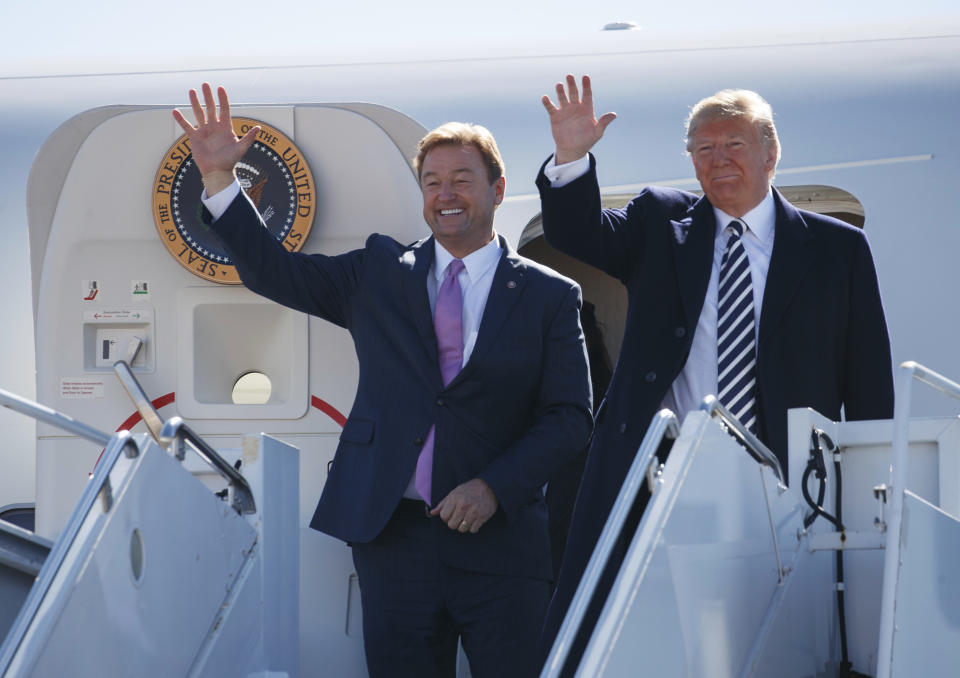 President Donald Trump arrives with Sen. Dean Heller, R-Nev., on Air Force One at Elko Regional Airport, Saturday, Oct. 20, 2018, in Elko, Nv., for a campaign rally. (AP Photo/Carolyn Kaster)