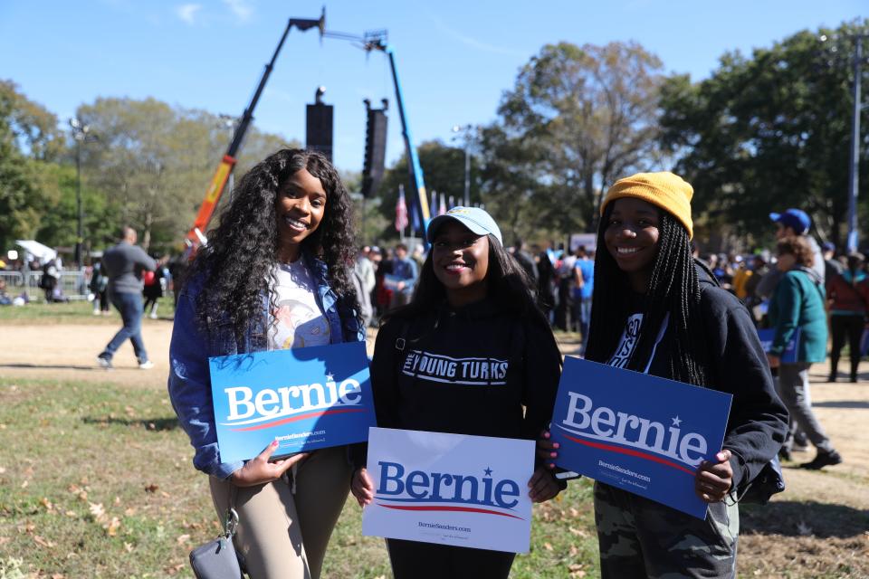 Three Sanders supporters at his Oct. 19 rally at Queensbridge Park. (Photo: Gordon Donovan/Yahoo News)