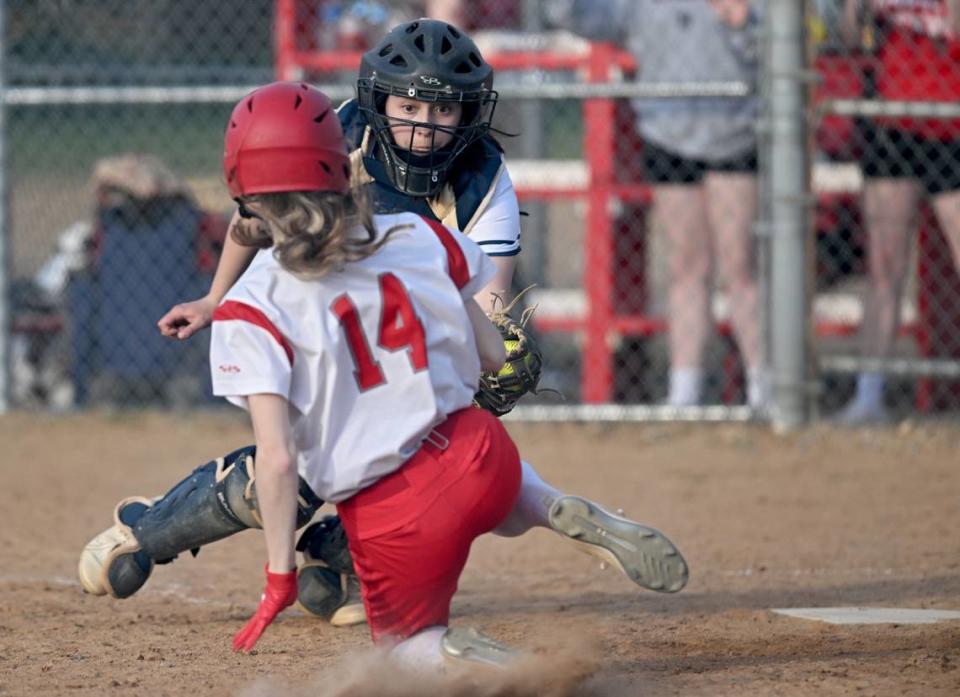 Penns Valley’s Ellie Coursen tags out Bellefonte’s Maria Cotter at the plate during the game on Tuesday, April 4, 2023.