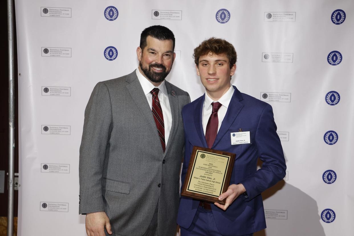 Fisher Catholic’s JJ Viau, standing with Ohio State head football coach Ryan Day, was one of only 14 Central Ohio High School Football Scholar-Athletes honored during the Columbus Chapter of the National Football Foundation and College Hall of Fame Awards Banquet, which was held last week on the campus of Ohio State University.