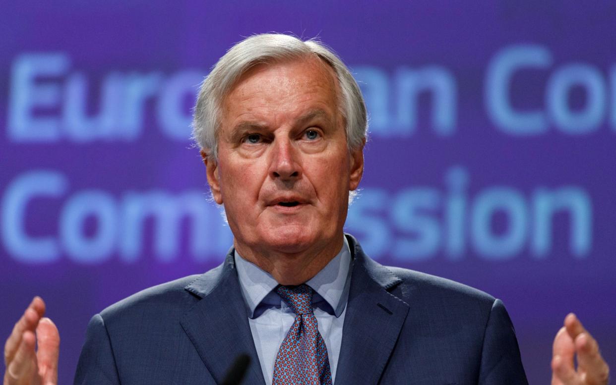 EU's Brexit negotiator Michel Barnier gestures during a news conference after Brexit negotiations - REUTERS