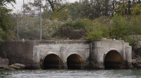 A view of the outfall pipes from The City of Detroit Water and Sewerage Wastewater Treatment Plant are seen along the Detroit River in Detroit, Michigan October 1, 2013. REUTERS/Rebecca Cook