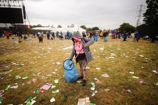 Litter pickers work to clear Worthy Farm