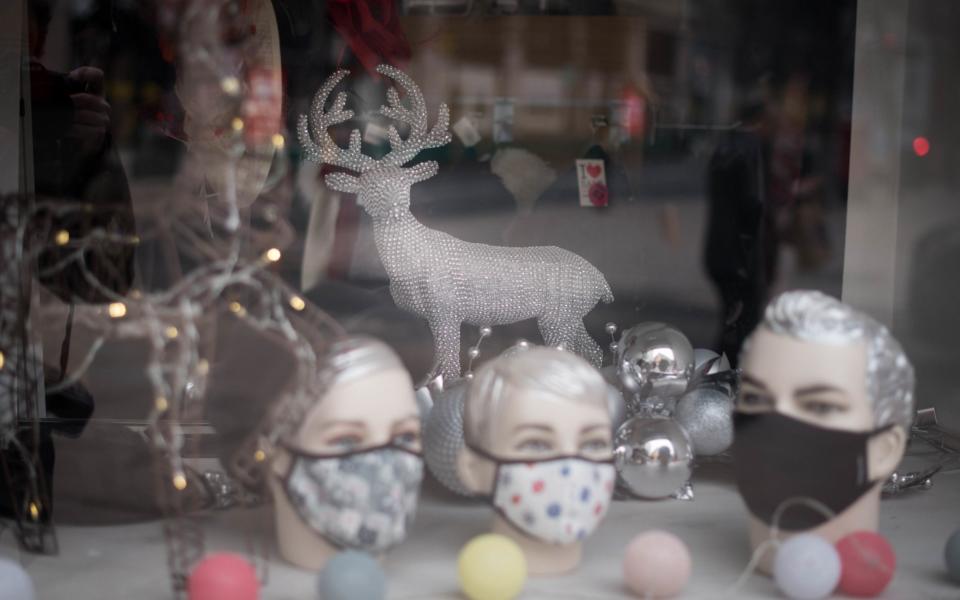 A shop on Oxford Street in London displaying Christmas decorations in March 2021