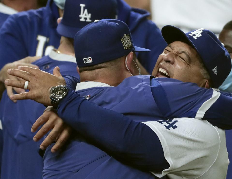 Dodgers manager Dave Roberts, right, exalts after the final out of the World Series on Oct. 27, 2020, in Arlington, Texas.