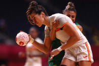 <p>Lara Gonzalez Ortega of Team Spain is challenged by Adriana Cardoso of Team Brazil during the Women's Preliminary Round Group B handball match between Spain and Brazil on day six of the Tokyo 2020 Olympic Games at Yoyogi National Stadium on July 29, 2021 in Tokyo, Japan. (Photo by Dean Mouhtaropoulos/Getty Images)</p> 