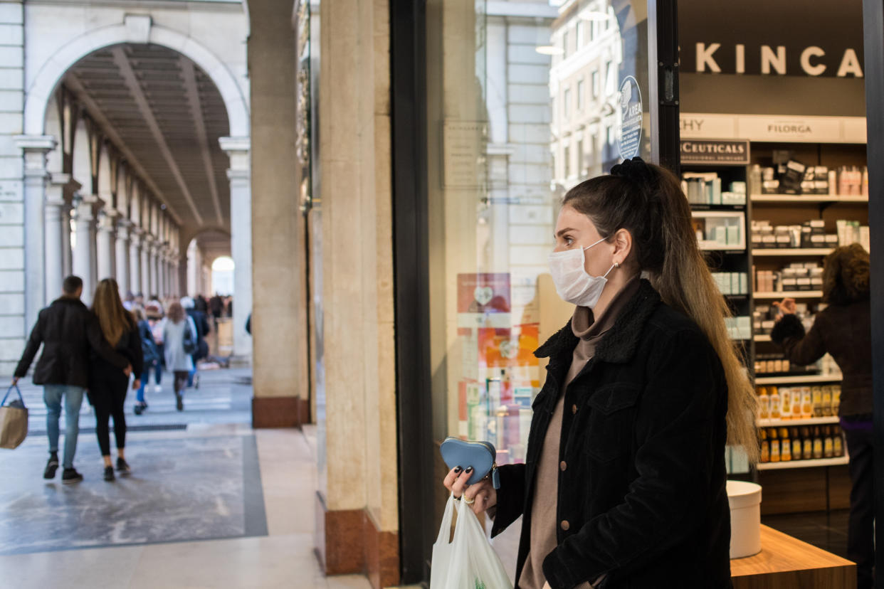 A young woman wearing facemask in Turin, Italy, on February 24, 2020. More than 220 people were infected by Covid-19 in Italy, with 6 people deaths. (Photo by Mauro Ujetto/NurPhoto)