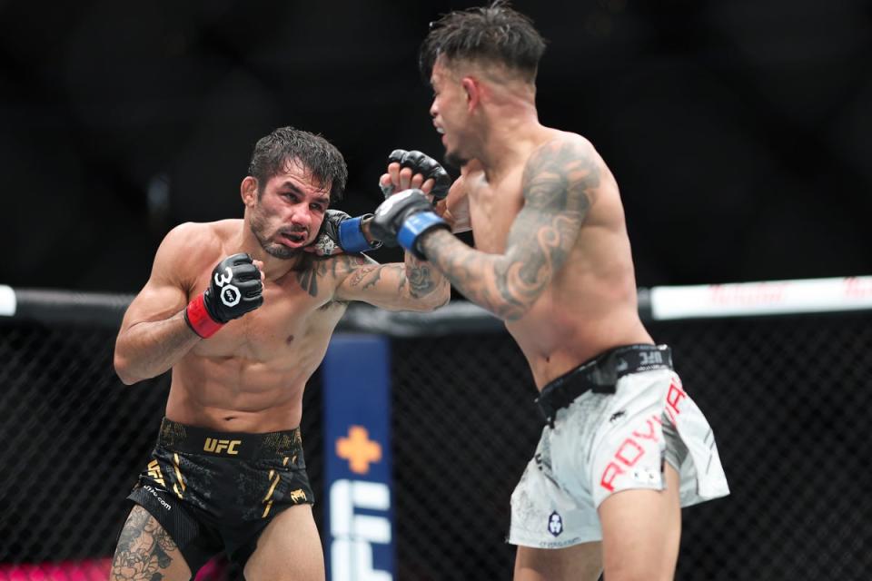 Alexandre Pantoja (left) during his decision win over Brandon Royval in December (Getty Images)