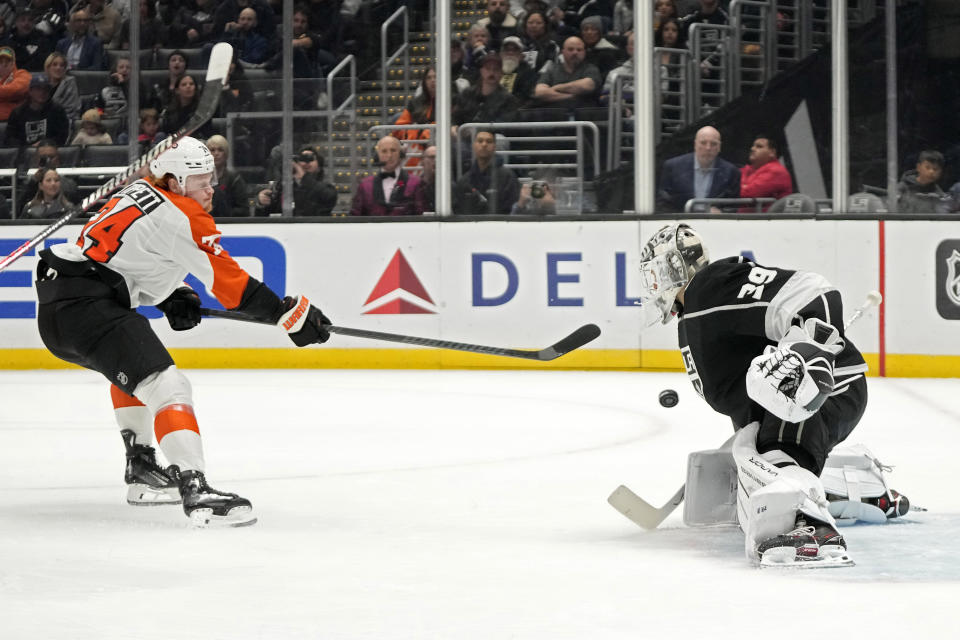 Philadelphia Flyers right wing Owen Tippett, left, scores on Los Angeles Kings goaltender Cam Talbot during the first period of an NHL hockey game Saturday, Nov. 11, 2023, in Los Angeles. (AP Photo/Mark J. Terrill)