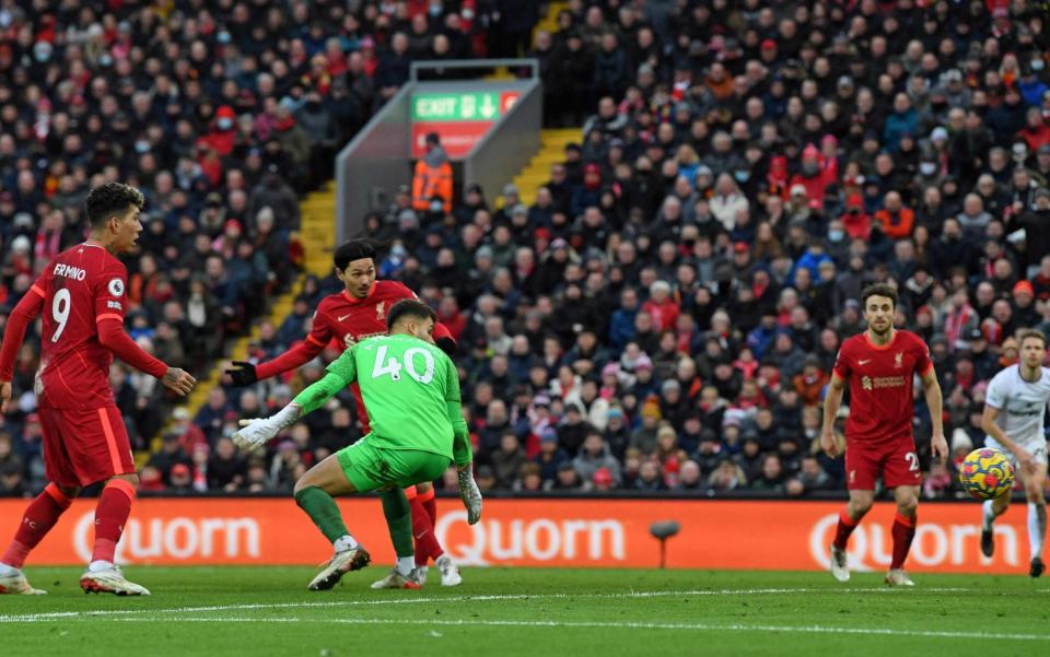 Minamino gets Liverpool's third. - Paul ELLIS / AFP