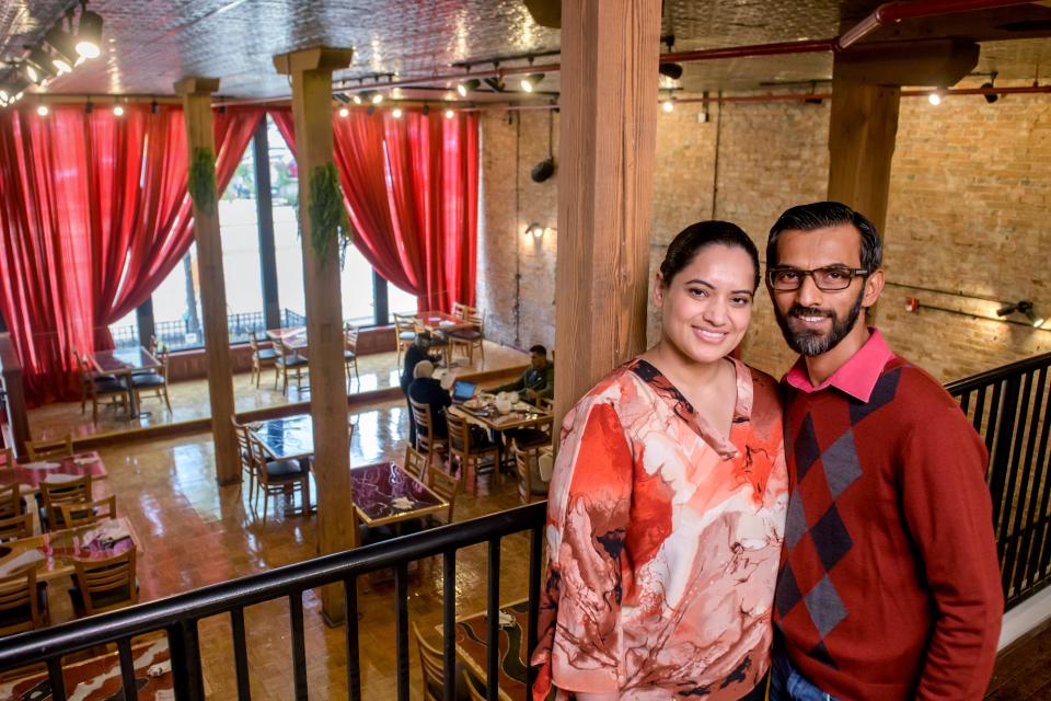 Owners Irfan Mohammed, right, and Shagufta "Muskan" Shaikh stand in the mezzanine overlooking the dining room of their new Indian restaurant Bollywood Bites Bistro & Events Center in the former Broadway Lounge space at 316 SW Washington Street in downtown Peoria. Bollywood Bites will hold its grand opening Friday, Oct. 13, 2023.