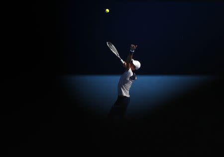 Tennis - Australian Open - Margaret Court Arena, Melbourne, Australia, January 16, 2018. Novak Djokovic of Serbia serves against Donald Young of the U.S. REUTERS/Issei Kato