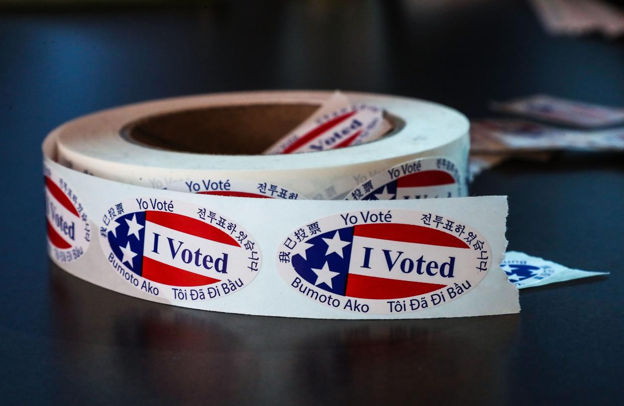 A roll of "I Voted" stickers awaits voters at the polling place at the Rancho Mirage Public Library on Monday.