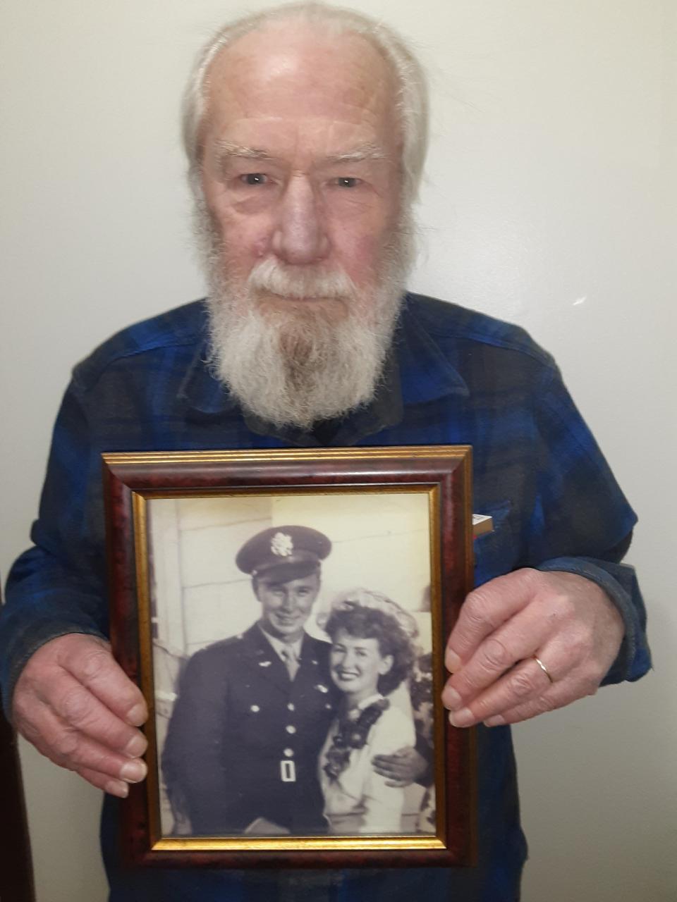 Minnesota resident George Campbell show the wedding photo of his parents, George and Lawanda Campbell, who died on the same day at age 96 in California after 75 years of marriage. Campbell overcame difficulties to obtain FEMA's funeral benefit for those who died of COVID-19.