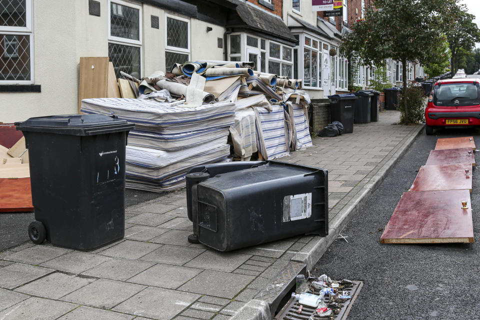 Smashed furniture, beds, split black bags full of rotting food, empty booze bottles and dozens of discarded face masks have been left strewn across the terraced streets in Selly Oak. (SWNS)
