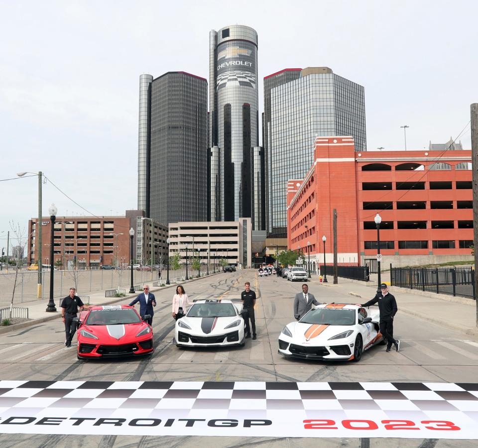 (From left) Detroit Grand Prix president Michael Montri, Detroit Grand Prix chairman Bud Denker, Detroit City Council president Mary Sheffield, Grand Prix winner Will Power, Detroit Deputy Mayor Todd Bettison and IndyCar driver Josef Newgarden pose at the finish line with the three Corvettes used in the ceremony commemorating the Detroit Grand Prix's move from Belle Isle to downtown Detroit on Monday, June 6, 2022, at the new finish line at Franklin and Schweizer Place.