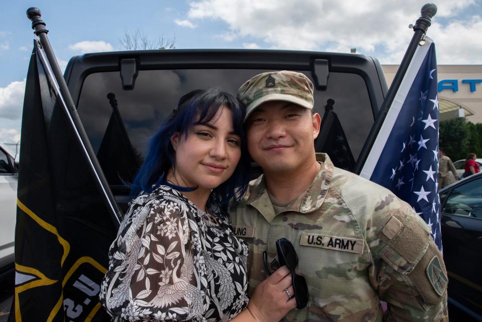 Staff Sgt. Paul Chung of Hobart and his wife, Marisol Ortiz, pose for a portrait, at Atlantic Aviation in South Bend, where 60 soldiers from the Indiana National Guard 76th Infantry Brigade Combat Team are welcomed from their deployment in Kosovo, on Thursday, July 13, 2023.