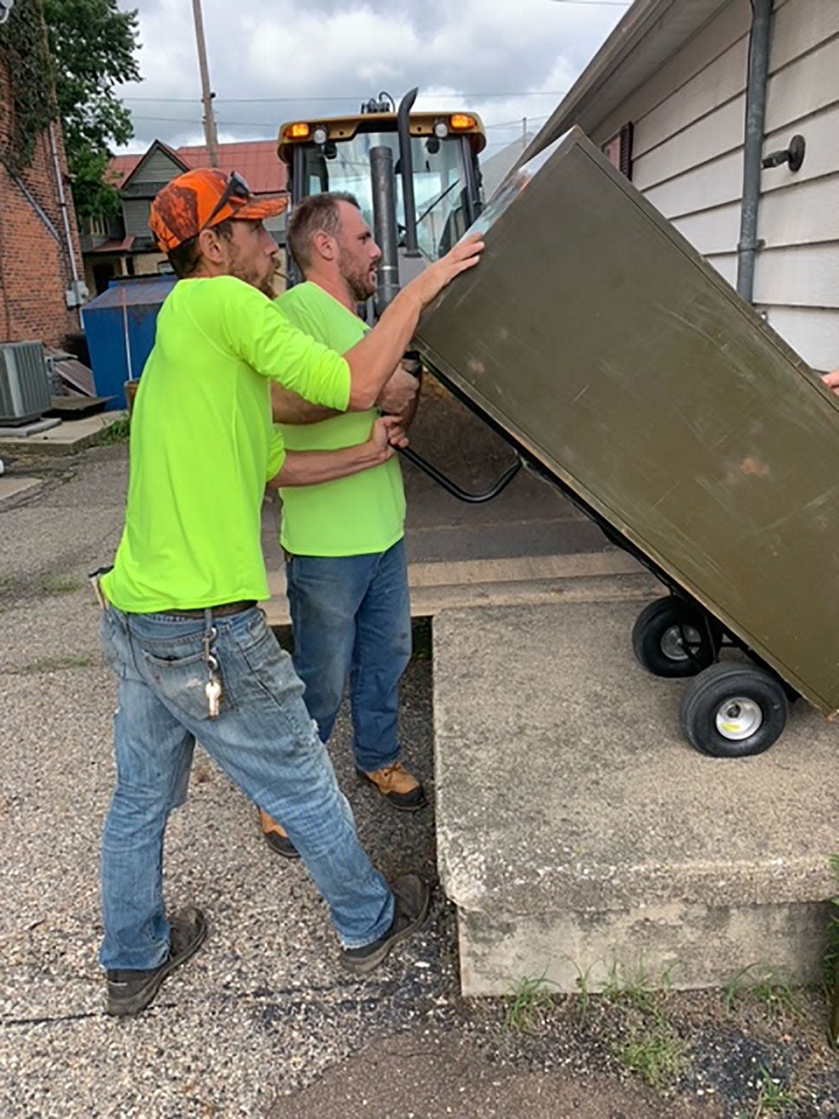 Colon DPW employees John Walls and Nate Martin maneuver a file cabinet Tuesday as part of the village office move to a new building a block away. The village is now operating from a former doctor's office at 111 S. St. Joseph St.