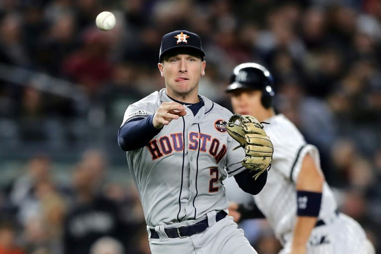 Alex Bregman of the Houston Astros fields a ball to end the third inning against the New York Yankees in Game Three of the American League Championship Series, at Yankee Stadium in New York, on October 16, 2017