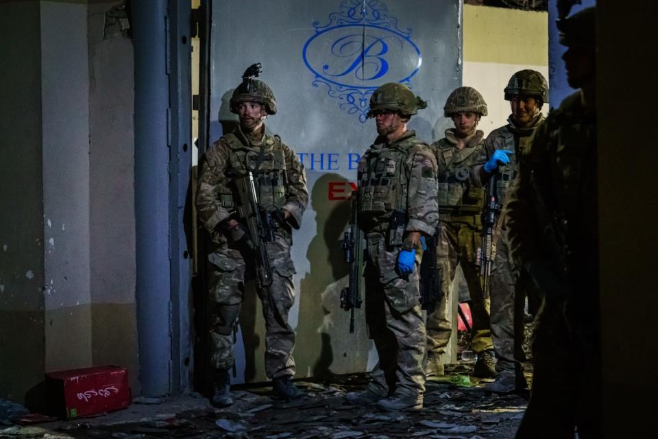 British soldiers secure the perimeter of the Baron Hotel, which is near the Kabul airport.