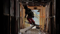 PIC FROM CATERS NEWS - (PICTURED; Logan Imlach skiing in the building) Most people prefer to ski on big snowy slopes, but as this jaw dropping video shows, Logan Imlach is no ordinary Skiier. Shot in Alaska by native Matt Wild, the two minute clip shows Logan skiing through a five floor tower block navigating the winding staircases and even jumping out of windows. Both Matt and Logan work in an oil field, where they work the same three week shift. SEE CATERS COPY.